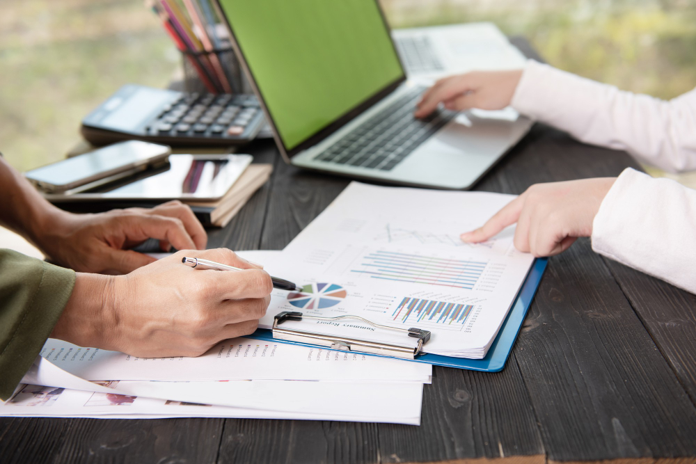 People analyzing data on documents
