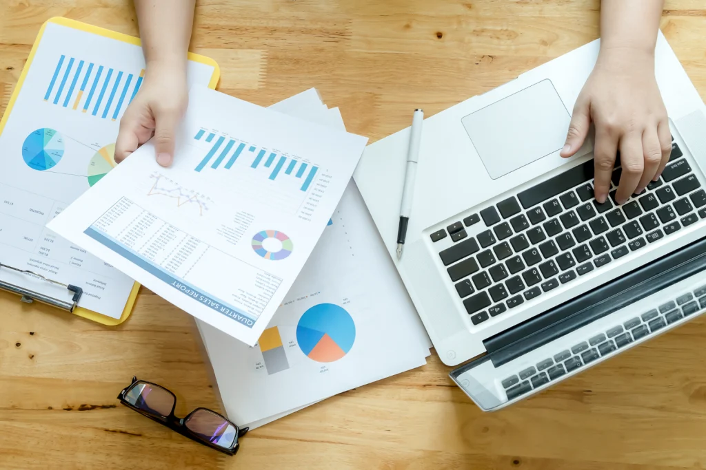 Person analyzing charts and data